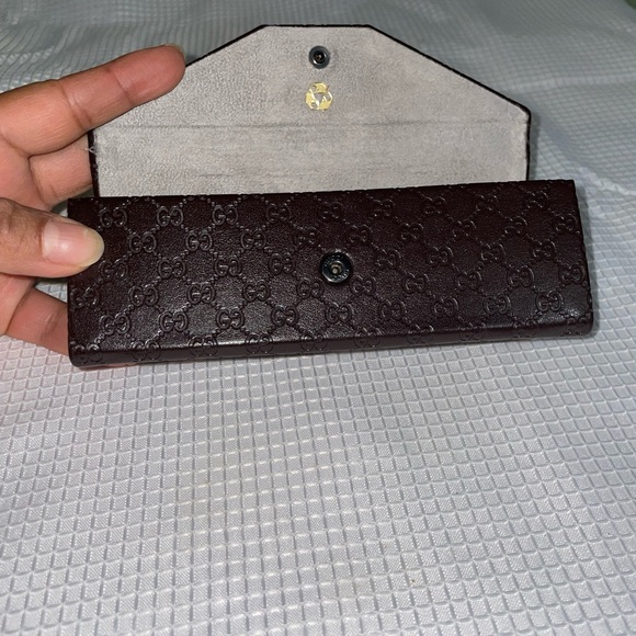 brown leather monogrammed foldable eyeglasses case from Gucci. - Picture 2 of 16